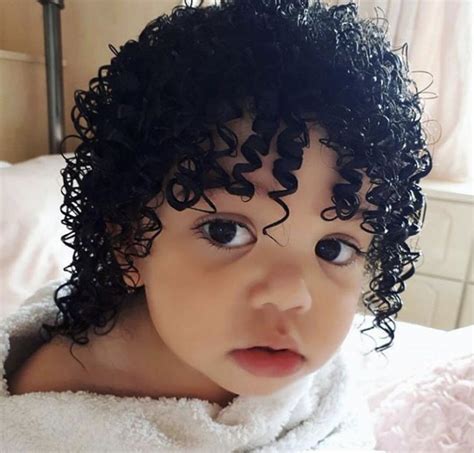 Are black babies born with curly hair?