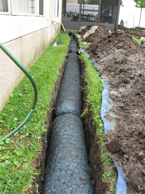 Can French drain be covered with dirt?