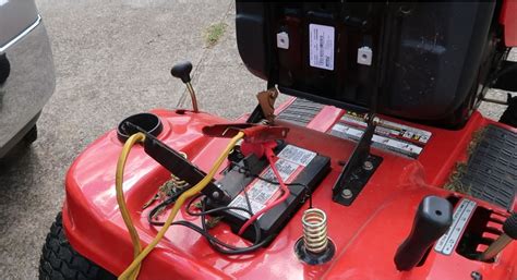 Can I charge lawn mower battery with car?