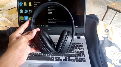 Can I connect my Bluetooth headphones to my laptop and phone at the same time?