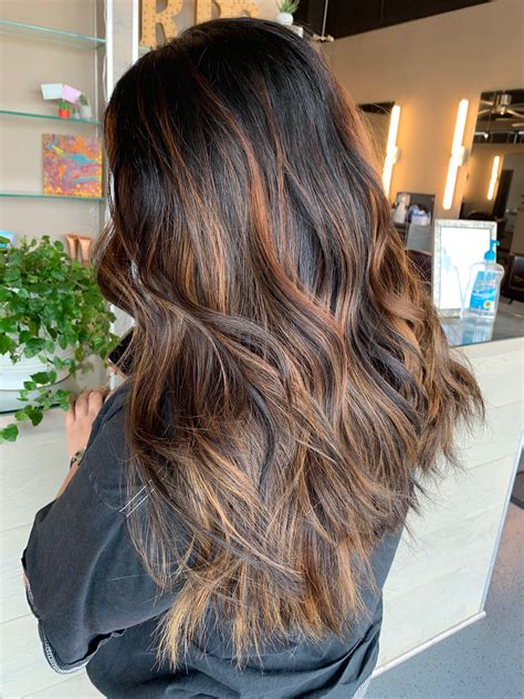 Can I dye brown over black dyed hair?