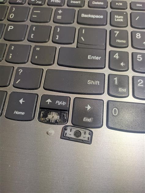 Can I glue a key back on my laptop?