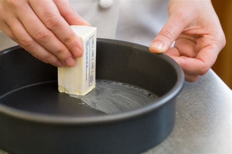 Can I use butter to grease a pan instead of cooking spray?