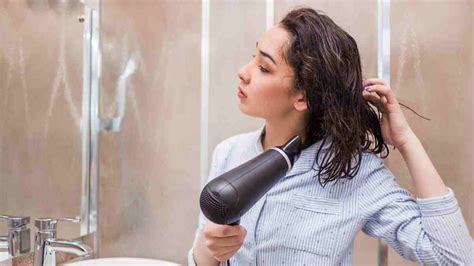 Can I use hair dryer to dry my phone?