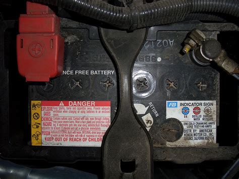 Can a flat battery damage an alternator?