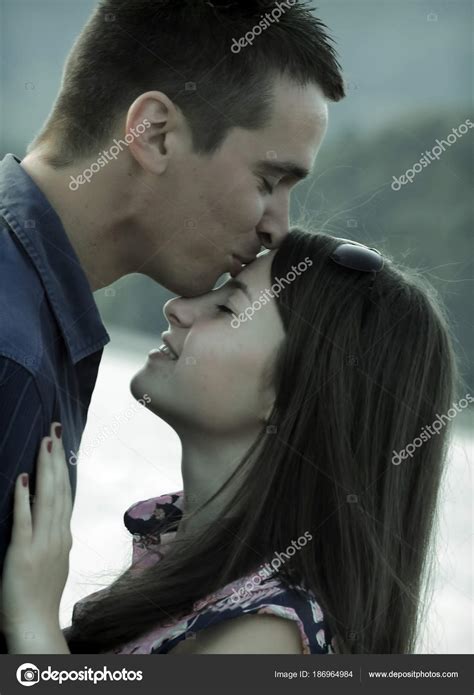 Can a girl kiss a guy on the forehead?