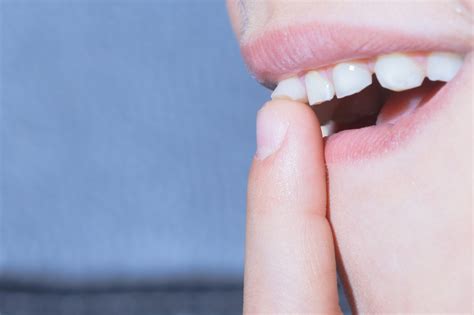 Can a loose tooth go back to normal?