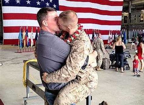 Can military members kiss in uniform?