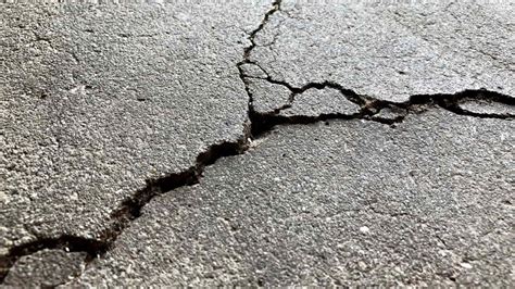 Can pressure washing cause cracks in concrete?