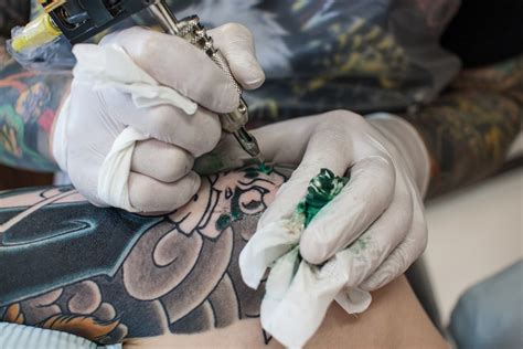 Can tourists show tattoos in Japan?