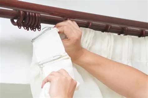 Can you dry clean curtains with hooks in?