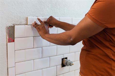Can you glue mosaic tiles to a wall?