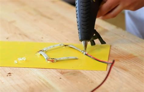 Can you hot glue light wires?