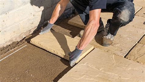 Can you lay slabs on concrete mix?