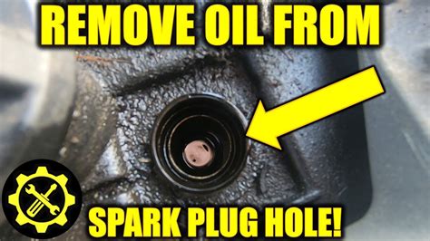 Can you put oil down a spark plug hole?