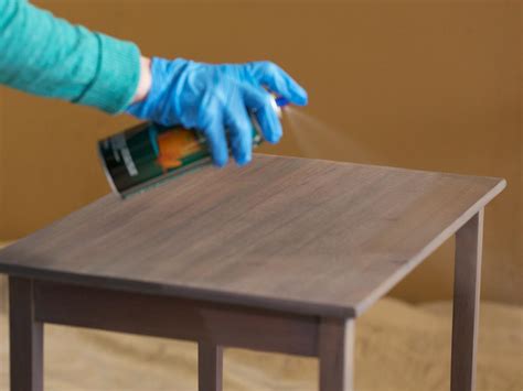 Can you sand a table after staining?