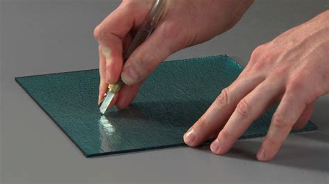 Can you scratch glass with paper?