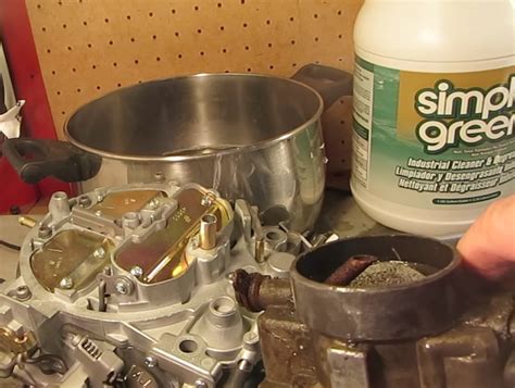 Can you soak a carburetor in gas to clean it?