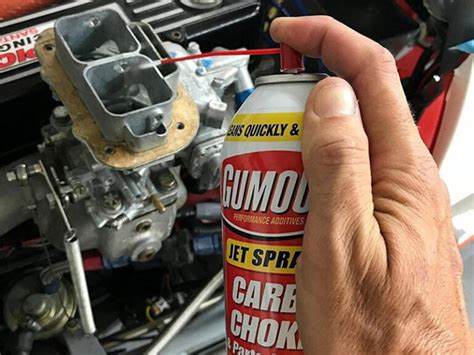 Can you spray carb cleaner into fuel injectors?