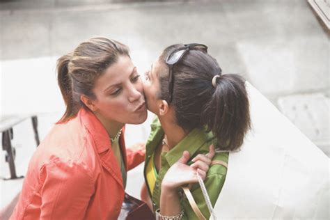 Do French Canadians greet with a kiss?