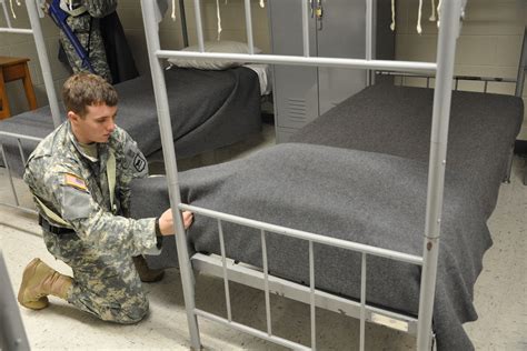 Do male and female soldiers sleep in the same barracks?