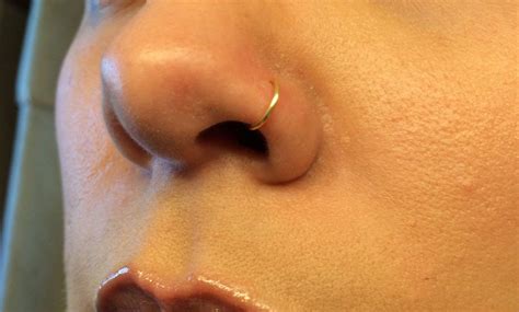 Do nose piercing holes grow back?