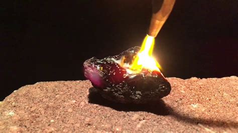 Do real crystals turn black when burned?