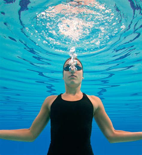 Do swimmers breathe through nose or mouth?