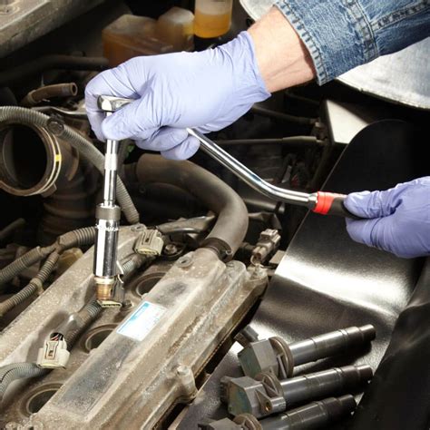 Do you need to remove spark plugs to change valve cover gasket?