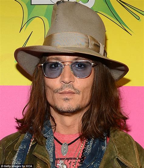 Does Johnny Depp wear tinted glasses?