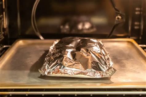 Does chicken cook faster with or without foil?