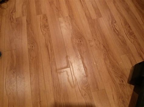 Does water ruin laminate floors?