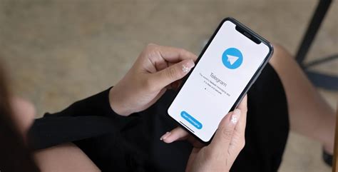 How can I know if someone saved my number on Telegram?