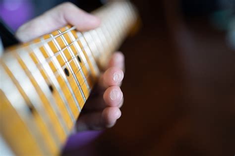 How can I speed up my guitar calluses?