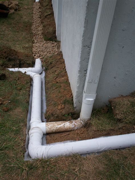 How deep should French drain be next to foundation?