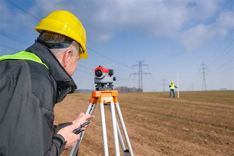 How do I become a land surveyor in BC?