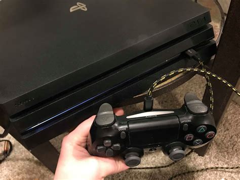 How do I disconnect my PS4 controller from my PS4?