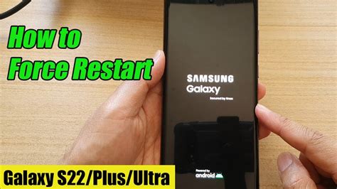 How do I force my phone to restart with a black screen?