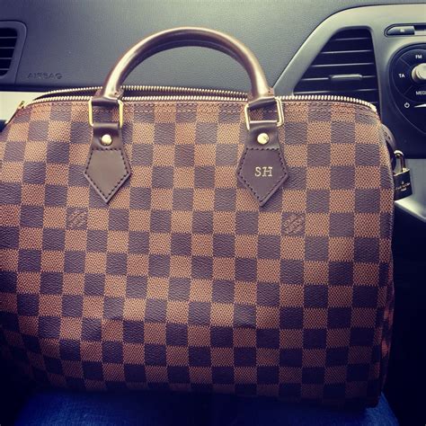 How do I get my initials on my Louis Vuitton bag?