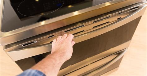How do I get rid of chemical smell in my oven?