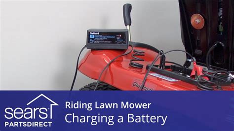 How do I know if my lawn mower battery is charging?
