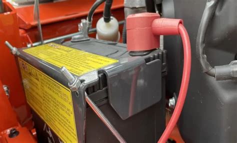 How do I know if my lawn mower battery is weak?