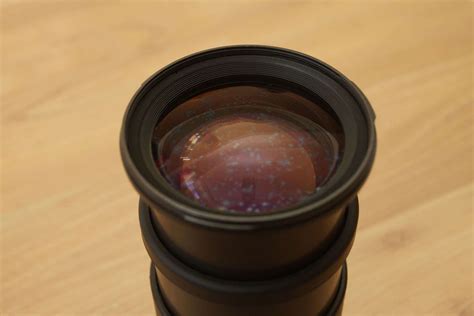 How do I know if my lens coating is damaged?