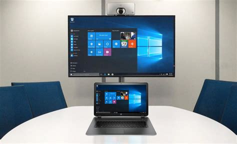 How do I mirror my laptop to my monitor?