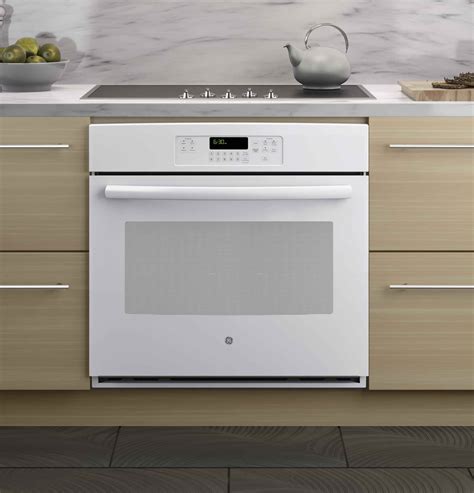 How do I prepare my new electric oven?