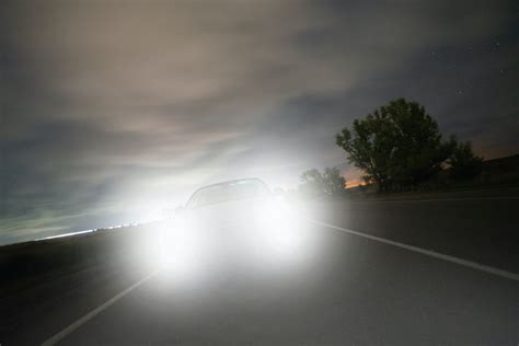How do I reduce the glare on my oncoming headlights at night?
