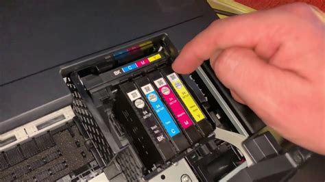 How do I squeeze more ink out of my printer cartridge?