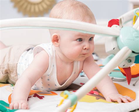 How do I start tummy time with my 2 week old?