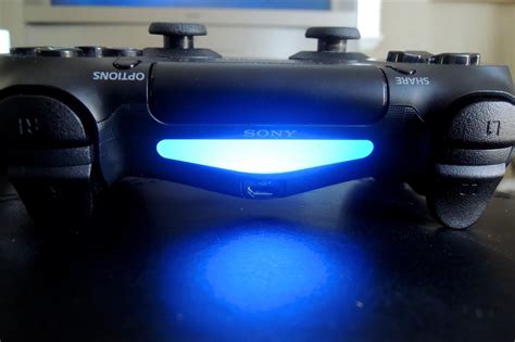 How do I turn on the light on my ps4 controller?