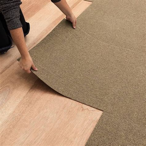 How do carpet tiles stay together?